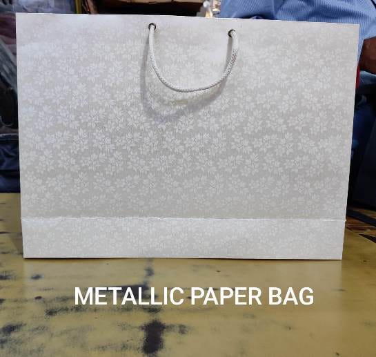 white metallic paper bag