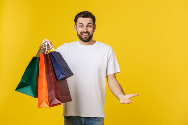 MAN CARRYING SHOPPING BAG